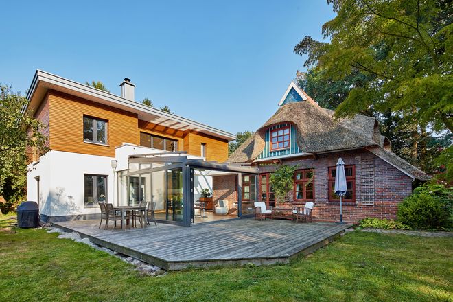 Planung nach Maß: Der Wintergarten verbindet den Altbau stilvoll mit dem Neubau.